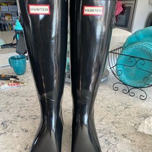 Black tall hunter boots